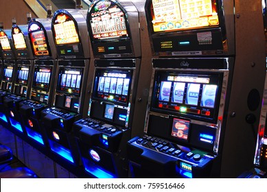 Atlantic City, NJ, SUA August 16 Slot machines, also known as one arm bandits, await the next player at a casino in Atlantic City, New Jersey - Shutterstock ID 759516466