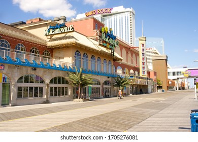 Atlantic City, NJ / USA - April 16, 2020: Government imposed COVID-19 restrictions have left Atlantic City's famed boardwalk virtually deserted and its iconic casino hotels boarded up and closed.