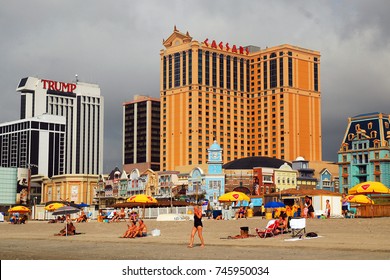 Atlantic City, NJ, USA August 16 Vacationers take a break from the Atlantic City, New Jersey casinos to sit on the beach, despite developing storm clouds