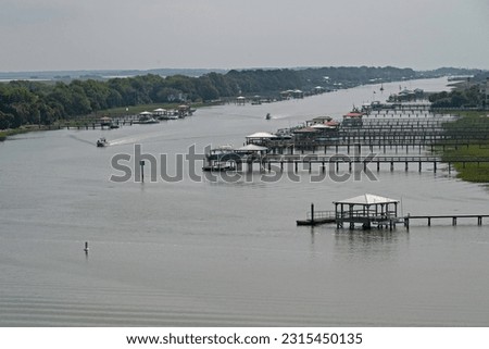 The Atlantic Intercoastal Waterway, with piers and boat slips, separates the towns of Mount Pleasant and Isle of Palms in the low country of South Carolina.