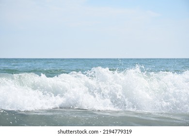 Atlantic Ocean Beach Waves On A Cloudy Day.