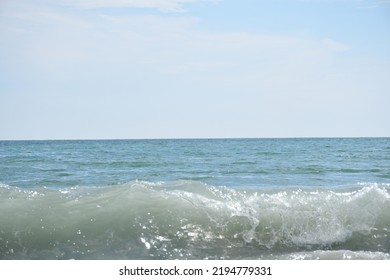 Atlantic Ocean Beach Waves On A Cloudy Day.