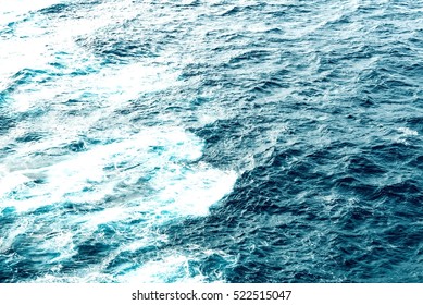 Atlantic Ocean With Blue Water On A Sunny Day. 
Waves, Foam And Wake Caused By Cruise Ship In The Sea, Effect Filtered Image For Tourism Business Concept, Cruise Sailing Blogs, Magazines Websites