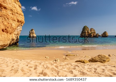 Atlantic ocean and cliffs at Praia do Camilo Beach, Lagos, Portugal