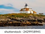 Atlantic Ocean Egg Rock Lighthouse on Mount Desert Island, Bar Harbor Maine, USA in summer.