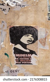 Atlixco, Puebla, Mexico, June 22 2022: Vintage Style Half Teared Feminist Sign Of An Afro American Woman Yelling In An Old Wall Of A 8m Protest 