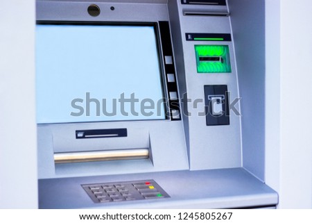 ATM machine blue background