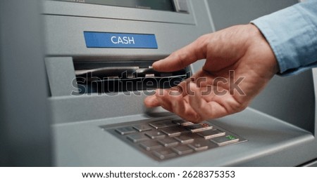 ATM Machine User Pressing Buttons on Display Screen, Taking Money from Cash Dispenser. Cash Withdrawal Operation from Bank Account. Automated Teller Machine, Banking System and Transactions. Close Up.