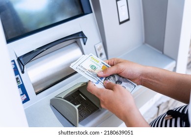 Atm money cash machine. Woman withdraw money bill. Holding american hundred dollar cash. Bank credit card, us dollar - Shutterstock ID 2180639051