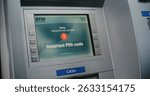 ATM User Entering PIN Code on ATM Keypad for Money Withdrawal. Error Message on Cash Machine Screen About Cancelled Transaction Due to Incorrect PIN Code. Cash Transactions, Banking System. Close Up.