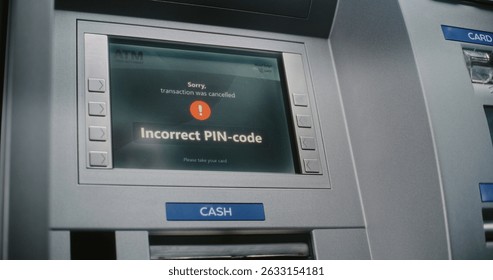 ATM User Entering PIN Code on ATM Keypad for Money Withdrawal. Error Message on Cash Machine Screen About Cancelled Transaction Due to Incorrect PIN Code. Cash Transactions, Banking System. Close Up.