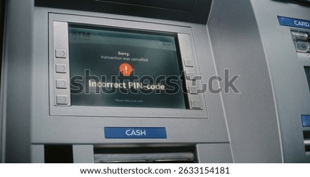 ATM User Entering PIN Code on ATM Keypad for Money Withdrawal. Error Message on Cash Machine Screen About Cancelled Transaction Due to Incorrect PIN Code. Cash Transactions, Banking System. Close Up.