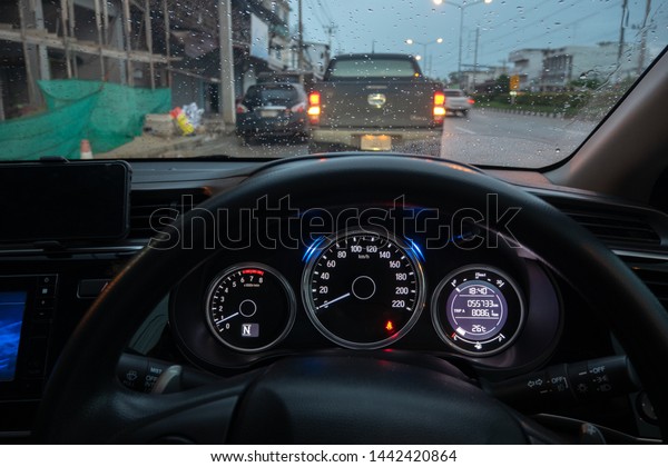 The atmosphere in
the car in the rainy season,Drops of water on windshield and blur
colorful background