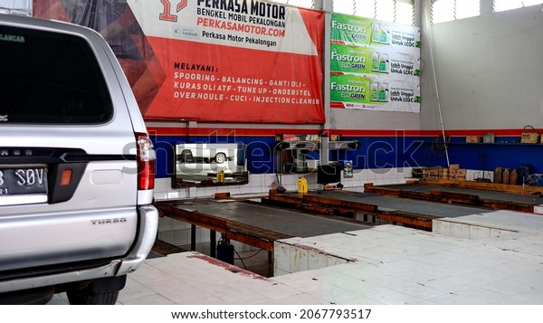 Atmosphere of a car repair shop, which\
is repairing consumer cars, Pekalongan, October 30,\
2021