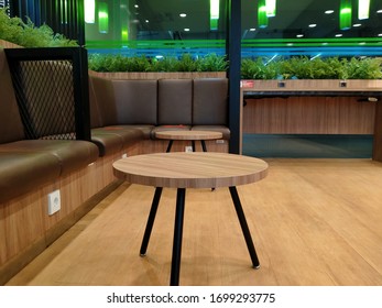 The Atmosphere Of A Coffee Shop With Interior Benches And Wooden Tables Is Also Green Ambience