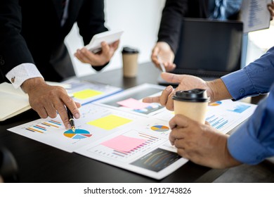 The atmosphere in the meeting room where the businessmen are meeting, information papers and charts are placed on the table to support the business planning meeting to grow. Business idea.