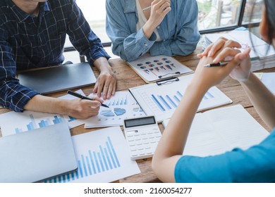 The atmosphere in the meeting room where the businessmen are meeting, information papers and charts are placed on the table to support the business planning meeting to grow. Business idea. - Shutterstock ID 2160054277