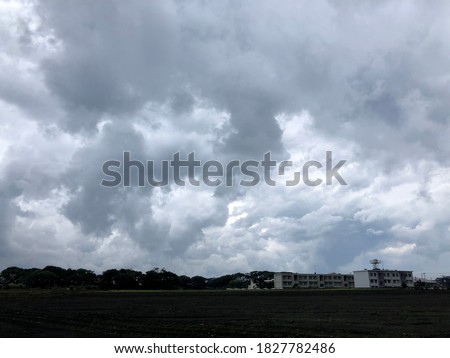 Atmosphere of overcast dusk sky before to rainy over the land and building.Natural gloomy sky weather background. Dramatic storm cloudy and dark sky. Dark clouds sky.