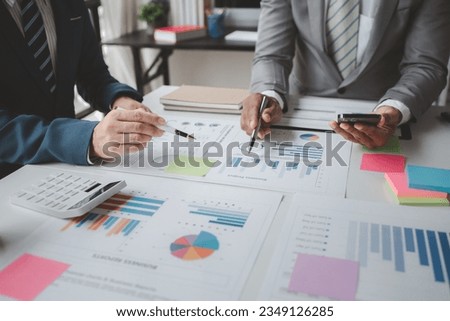 Atmosphere of a startup company meeting, business people are meeting together to summarize and plan investment finances, they are the founders of the company. Business administration concept.