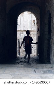 Atmospheric Alleyway Silhouette Boy Running Through Stock Photo ...