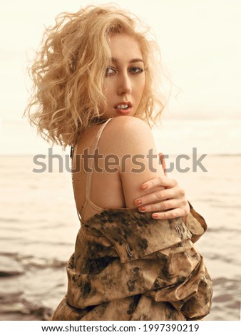 Atmospheric portrait of a blonde girl. Boho chic style.