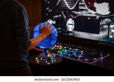An atmospheric scene featuring an interactive blue globe and a futuristic screen displaying digital data. A person explores the world through modern technology, illuminated by neon lights