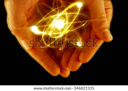 Atomic orbitting particle being held in cupped hands