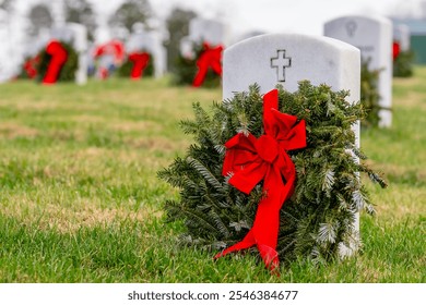 Atop a hill, a veterans cemetery with white headstones and the American flag evokes deep honor, sacrifice, and enduring national pride. - Powered by Shutterstock