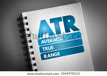 ATR Average True Range - technical analysis volatility indicator for commodities, acronym text on notepad