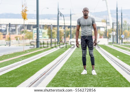 Similar – Black man practicing yoga in urban background.