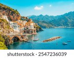 Atrani famous coastline in southern Italy, vertiginous cliffs adorned with colorful villages, turquoise waters. Small town Atrani on Amalfi Coast in province of Salerno, Campania region, Italy