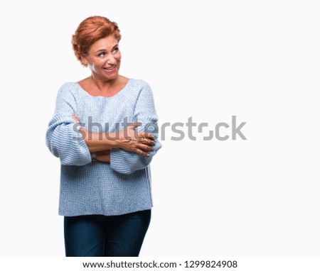 Atrractive senior caucasian redhead woman wearing winter sweater over isolated background smiling looking side and staring away thinking.