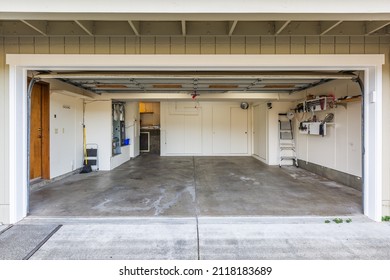 Attached Garage In Wine Country Shot From The Outside, Cement Slab, Cabinetry, Organized, Clean