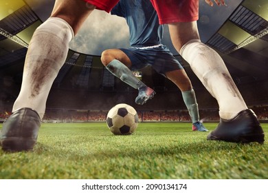 Attack. Close-up male soccer, football players' legs with football ball at the stadium during sport match. Sport concept. Sport competition. Action, motion, energy and dynamic concept. - Shutterstock ID 2090134174