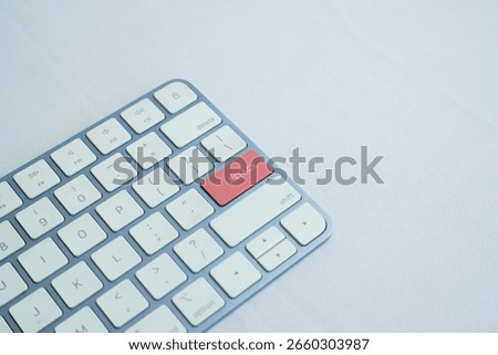 attack writing on a computer keyboard on a white background