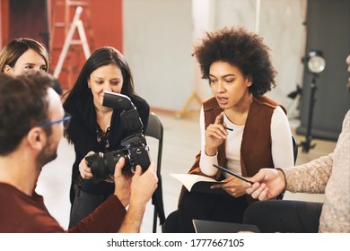 Attendees Attending A Photography Course In Studio.