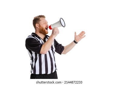 Attention to all players. One young bearded man, soccer or football referee shouting at megaphone isolated on white studio background. Concept of sport, rules, competitions, rights, ad, sales.