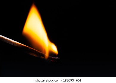 Attention, Dangerously Ignite A Match In The Woods, Dry Grass, A Large Fire Flame On A Black Background