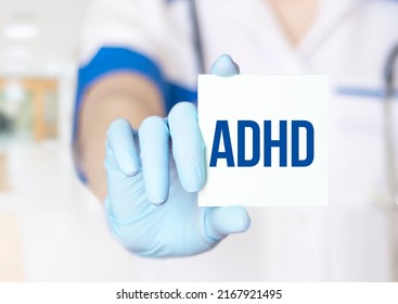 Attention Deficit Hyperactivity Disorder - ADHD - Doctor With Card On White Background