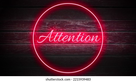 ATTENTION Red Neon sign in cirlce on wooden background for your design
