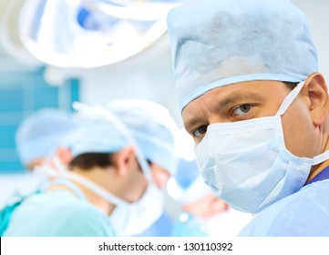 attentive look of surgeon in operation room - Powered by Shutterstock