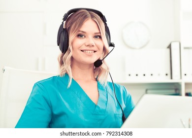 Attentive Specialist Of Medical Call Center In Headphones In Office