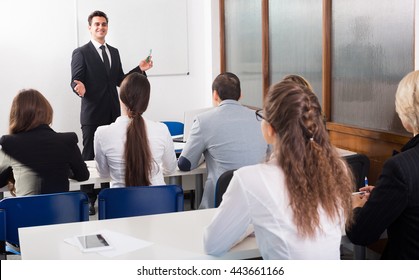 Attentive Students With Teacher In Classroom At Business Training 
