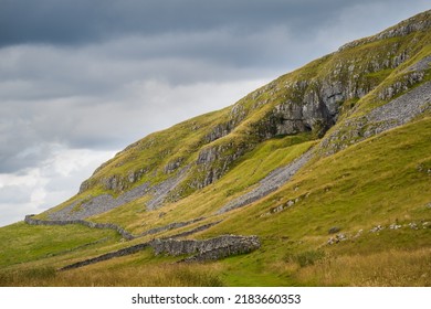 Attermire Scar is the dominant feature along the line of the Mid Craven Fault to the east of Settle - Shutterstock ID 2183660353