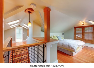 Attic Bedroom With Low Ceiling And Green Walls