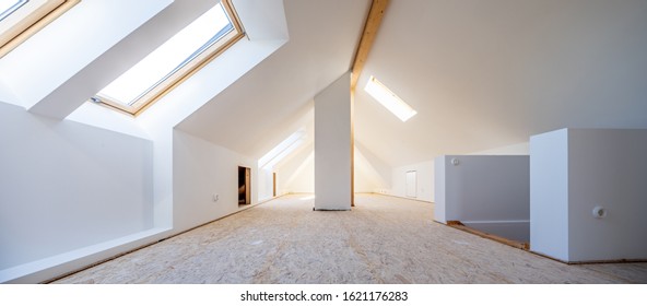 Attic is converted into light spacious living room - Shutterstock ID 1621176283
