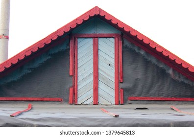 Attic Outside At The Top Of An Old Small House With A Door