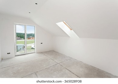 Attic Room Under Construction With Gypsum Plaster Boards And Windows