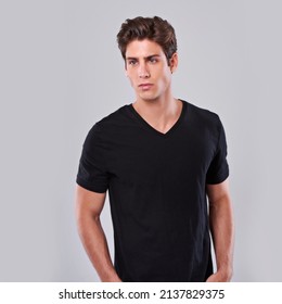 Attitude In Black. Studio Shot Of A Young Man In A T-shirt.