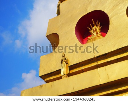 The attitude of meditation and standing Buddha image on the pagoda in temple. Many type of Buddha statue depends on charactor or posture of Buddha.